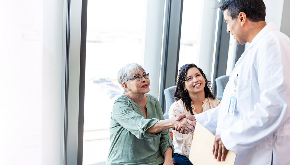 A doctor meets his patient and her daughter